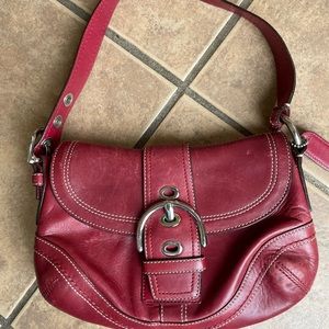 Vintage raspberry-colored Coach bag.